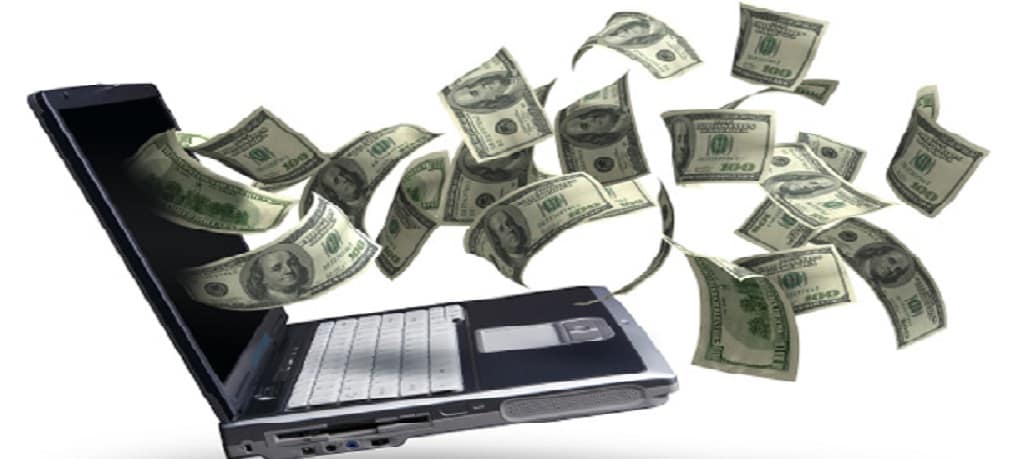 money bills flying from laptop